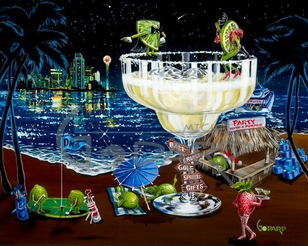 Several green olives partying on the beach of a lakeside Margarita Club. Two limes dance atop the large margarita.